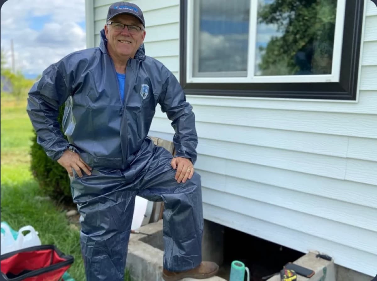 Lance Ritchie in rain gear at a Treasure Valley job site